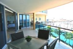 Mulherin Drive Mackay Harbour QLD 4740 There is nothing more prestigious than Puerto Galera. For the discerning few who seek the very best, we offer this beautifully appointed luxury penthouse style apartment for sale. On entering, the floor to ceiling glass captures one of the most spectacular views sweeping across the marina and beyond to the scenic beach. You will be immediately aware of the generous open floor plan maximising space, natural light and ventilation and how every room is so luxuriously appointed.
