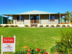 28 NORTH WEST ROAD Badgingarra WA 6521 Take a more simple approach to life and live a relaxed laid back lifestyle away from the hustle and bustle of the city. This lovely modern 3x2 home offers just over one acre of low maintenance living in a quiet community that is just two hours from Perth and also two hours from Geraldton. This home offers:- • A lovely modern feel with two large living areas • Open plan living area with a recessed ceiling and down lights • Spacious lounge room • Fantastic kitchen with corner pantry, gas stove and room for a large fridge • Three large bedrooms with the master bedroom having a walk in robe as well as large built in robe and an ensuite • Family bathroom has a shower and a separate bath • Reverse cycle split system air conditioner to keep you comfortable all year round • A dream Colourbond steel framed workshop/man cave that is 9m x 12m. It features two electric roller doors, one manual roller door, single and three phase power, a toilet, sink and an enclosed outdoor shower with a gas hot water system • Eight year old steel framed home that has a lovely wide verandah that wraps around it • Solar hot water system, connected to scheme water and also 2 x 32,000 litre rain water tanks that are both full • Well established lawn and gardens featuring a large ornamental fish pond, large enclosed irrigated vegie patch, fruit trees, plenty of wildflowers and a chook yard Badgingarra offers a primary school, post office, mechanics, hardware store, roadhouse/petrol station, tavern/restaurant, recreation centre with tennis courts and bowling green, fire brigade, a large town oval and the golf course which is across the road from this property. Its located just 60 kilometres from Jurien Bay which offers some of the best beaches in WA and also 60 kilometres from Moora. Take a drive today and experience this delightful property for yourself.