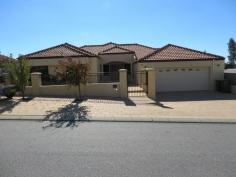 4 Wexford Meander Landsdale WA 6065. Have you been dreaming about living in style in a custom designed split
level home, Well this home is for you, 4 Double bedrooms all with built
in robes, master bedroom with spa plus study (this room could be used as
another bedroom) 3 bathrooms, 4 wc's, ducted air conditioning, ducted
vaccum cleaning system, huge games room, theatre room, huge granite chef
kitchen, beautiful alfresco area with below ground pool, timber
flooring throughout the house and much more.