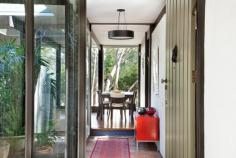 Deepwater Rd Castle Cove NSW 2069
Cook House, commissioned by David and Adrienne Cook on
Deepwater Road, Castle Cove, was designed by the Sydney architect John
James (b.1931) in the first four years of his Sydney practice.
Drawings approved by Willoughby Council reveal that James designed
the freestanding house in 1961 with plans approved in 1962. This is his
first house in Castle Cove; James also designed a second residence in
Castle Cove, the Denis Croneen House, in the following year.
Stylistically, in its siting, design, planning and materials, the
Cook House was originally conceived by John James as an mid-20th century
expression of a regional modernism uniquely associated with the
landscape of the Sydney basin with its sandstone escarpments, native
bushland and challenging topography.
James used the flat roof, cement-bagged masonry, timber structure,
cladding and the generous glazing that now characterises many of the
houses associated with Sydney-based regional modernism. Other regional
practitioners of his generation include Russell Jack (Allen, Jack +
Cottier), Sydney Ancher, Ross Thorne and Peter Muller.
The low profile design, featuring wide eaves and large expanses of
glass that allow each room a view of the surrounding landscaping, sits
at the bottom of a rock shelf. The 761 sq m block enjoys direct access
to North Arm Reserve and views over to Middle Cove.
The house is accessed from the end of a shared right of way leading
off Deepwater Road. From the carport, a winding labyrinthine pathway
leads down to the house. Cook House was purposely designed to be hidden
from the street and today mature landscaping enhances the original
design concept further.