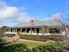 27c May Street Robertson NSW 2577 • Perfectly sited on approx 2700sqm in exclusive cul-de-sac • Timber French doors opening to front & rear verandahs from living areas • Honey hued polished hardwood floorboards throughout • Chef’s kitchen with Caesarstone benchtops, gas cooktop, abundant cupboards • Formal living area with SC Fireplace ducted throughout • Separate fully lined double garage + small 3bay shed So stylishly presented – we’re proud to market this residence!