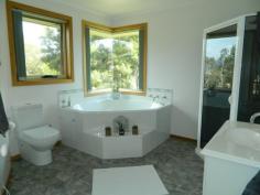 139 Saddle Road, Magra, TAS 7140 You must see this gorgeous home. It is situated on a completely private, internal, 1.38 hectare block, only five minutes from New Norfolk. The living area of the home comprising a sunroom entrance, wonderful kitchen, dining area, sunken lounge and rumpus room, is in the centre of the house. A veranda folds around the entire front of the home. The left wing has two big bedrooms with robes, a family bathroom, plenty of storage and a laundry. The parents’ wing, at the opposite end, also has two bedrooms and a lovely en-suite off the master bedroom. The home has quality fittings and is tastefully decorated throughout. Established gardens, barbecue area, a big garage, workshop and paddocks suitable for a pony contribute to making this a wonderful family residence. Call for a private inspection.
