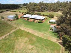8 Dove Ct Mundaring WA 6073 You will be very impressed with this Rural Building home built in 2001, situated on 11.71 acres of lush pasture with bore & 2 gorgeous dams - 1 spring fed!PERFECT FOR YOUR EXTENDED FAMILY! Both homes are top quality with a neutral decor, high ceilings, good sized floor plans, wide verandahs all round & double carport to separate the two. Ideally located just 15 minutes to Midland CBD via Toodyay Rd, with Gidgegannup Primary school 5 minutes away, this represents top value buying. The orange tree-lined driveway and the immaculate presentation of the entire property will charm you, as will the six lush paddocks & permanent water supply. All fencing & gates are top notch, the 30 x 40ft shed is spacious & powered, and there is nothing to do than move in, sit back & relax. Whether it is Gran & Pop or older kids you need to accomodate, you will be well pressed to replace this at this cost! These brick & iron homes feature the main home with 3 bedrooms, 1 bathroom, lounge/ dining & kitchen open plan, activity room or study with laundry & separate wc, whilst the granny flat has 2 bedrooms, bathroom & laundry together & separate wc. Both have Thermo Duk insulation,they share a solar hot water system, both have electric cooking, with 1 x split system air conditioning unit each.The main home also has a wood fire which doubles as an oven! Owners are keen to negotiate a deal & are wanting to travel! Please call Jan to inspect on 0408 915 281