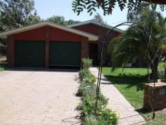 88 Northern Road Roma Qld 4455 This beautifully presented lowset brick home boasts 4 built-in bedrooms, master with walk in robes and ensuite. Modern kitchen with dishwasher and pantry, separate dining and separate living areas, wood heater, ducted air conditioning plus reverse cycle in main. Large tiled bathroom with separate shower and bath. Fully screened with security doors, new floor coverings, new paint work inside, 2 bay lockup garage, paved and covered outdoor entertainment area leading off into the established lawns and gardens. Two rainwater tanks, separate 3m x 3m garden shed and rear yard fully fenced, all this in a flood free area.