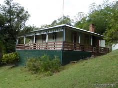 29-31 Mount St Kyogle NSW 2474 Lookout Views Positioned on over an acre of land (4287M2) with views second only to Kyogle's lookout. This home affords spectacular views of the town below and far into the distant ranges. High ceilings and wood panelling throughout, appealing to those looking for a home filled with character and country charm. Three spacious bedrooms are on offer, two of which have French doors opening onto the timber verandah. Three air conditioners provide cool or warm air ensuring utmost comfort throughout the year. The kitchen is less then 2 years old and the bathroom and laundry are neat and tidy. There is under home parking and storage and a garden shed for the tools. You will be seduced by the charms of this country home.