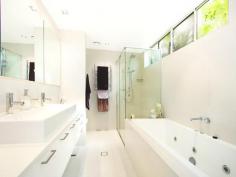 3/61 Garrick Street Coolangatta Qld 4225 Stylish, immaculate, bright and spacious, this stunning 2-bed apartment offers a superior finish & quality to what you’ll find in the standard modern home today. Perched high on a sheltered, quiet street in Coolangatta, just a short stroll to cafes, shopping and the Coast’s best beaches, the apartment’s contemporary interiors seamlessly flow to a superb, protected outdoor living space with coastal panoramic views which come alive at night. Set on the second level of this award-winning architecturally-designed boutique building, Apartment 3, Rainforest Apartments, is a sleek, stylish and sophisticated 150m2 residence with high ceilings, ducted air-conditioning and polished porcelain floor tiles. There’s plenty of storage and preparation space in the ultra modern kitchen, featuring granite bench tops, Mîele appliances, breakfast bar, and ocean views. Or if you want to fire up the BBQ, peel back the timber bi-fold doors on your private 27m2 terraced balcony, grab a wine and watch the sunset’s colours light the sky. Entertain guests in style and comfort, but they may never want to leave. The superior master bedroom offers a spacious walk-in wardrobe, impressive en-suite with floor to ceiling tiles, a spa bath, shower and quality fixtures and fittings. Laze in the residents’ saltwater pool and spa surrounded by rainforest-themed gardens and sandstone tiles, or entertain guests under the thatched Balinese pavilion with BBQ. Included in this beautiful building are established gardens, secure lift access, intercom entry, secure accommodation for 2 cars, storage cage and plenty of off-street visitor parking. • Residential building • Only 6 apartments in building – quiet, close-knit community. • Ocean panorama from Rainbow Bay to Cook Island • Timber bi-folds span the whole balcony terrace for seamless flow of indoor/outdoor living • Sleek, stylish, sophisticated kitchen with Mîele appliances • Audio-visual intercom security • Ducted air conditioning • Very low body corp • Residents’ saltwater pool with thatched Balinese pavilion with BBQ & fridge • Two secure car parking bays – with cage • Located on leafy, peaceful street • Master Builders Queensland 2008 Winner Best Residential Building up to $12 Million • Walk to cafes, restaurants, shops and the beach • 5-minute drive to Gold Coast Airport • Only 45 minutes to Byron Bay