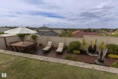 22 Catspaw Ave Beeliar WA 6164 COME FEEL RIGHT AT HOME HERE!! As you walk in the large double door entrance you immediately get that feeling of quality and that you truly are at home. This stunning 4 x 2 family home is situated in the much loved Meve Estate, positioned on the street to capture stunning views of the city and surrounding area. *Large king size master Bedroom with his and her walkin robe, which leads to a great size ensuite. The ensuite is tiled from ceiling to floor and includes large corner spa bath, vanity, shower, IXL light/heat lamps and separate toilet. *Remaining bedrooms are all queen sized with carpet, bedrooms 3 and 4 have stunning views and complete with walk in robes. *Outside entrance features cedar lined ceiling with downlights. *Sunken lounge room with beautiful lighting and carpet. *Separate formal dinning area. *Stunning kitchen with large bench top giving plenty of room for a breakfast bench, lots of cupboards including overhead cupboards, stainless steel appliances including electric oven, gas hot top with range hood, dishwasher, double sinks and large pantry. The shoppers entrance allows for easy access. *Kitchen is part of open planned area, over looking another dining area and 2nd lounge which leads to alfresco area. *Large reverse cycle ducted air conditioner. *Gas bayonet for extra heating is located in the open planned area. *Large linen, big laundry with separate toilet. *Black Butt flooring throughout. *Feature lighting throughout home as well as outside just show the class of this home. *Large paved outdoor entertaining area has cedar lined ceiling with down lights, caf blinds to fully enclose the area and spectacular views. *There is a great patch of grass but the feature of the backyard is the lower decking area and water feature, fantastic for entertaining and finished with a no fuss garden with automatic reticulation. There is also a rear gate for access from the front. *Large double garage with automatic door with extra room for storage. Located near local shops, primary schools, easy public transport and just minutes to both Cockburn Gateways Shopping and Coogee beach this home is a must see.