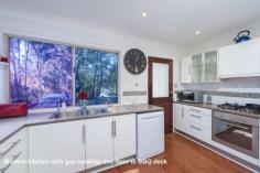 First Choice Property Centre - TAMBORINE MOUNTAIN 12 Jura Court Just you and the birds are here to enjoy this wonderful oasis of peace
and tranquility, backing onto a nature reserve it will never be built
out. You will never want to leave, which is a great possibility as
there is a great space downstairs to work from home. Guest will love
the downstairs fully self-contained area but be careful because grown up
children may never want to leave home!! ~ Split level mountain style home ~ Fabulously high cathedral ceilings in the lounge ~ Glass sliding doors to a large covered rear deck ~ Light flooded living with big windows all round ~ Modern kitchen with plenty of bench space & storage ~ Three bedrooms on the upper level with built in robes ~ Freshly modernised bathroom with separate toilet ~ Down to another spacious lounge room with kitchenette ~ Fourth bedroom with window overlooking garden ~ Shower room downstairs ~ Great additional room with an external door to the driveway ~ Sliding glass doors to a lovely covered patio ~ Easy care gardens leading down to a babbling brook ~ Double carport with space to put in a garage if wanted ~ Fully renovated there really is nothing to do here
