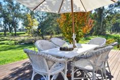 1692 Benalla-Tatong Road MANSFIELD VIC 3722 Resting amongst an absolutely gorgeous backdrop, this charming rustic hideaway is purely a must to inspect, because it will not last long! Set on 10 acres approx (including creek front leasehold - 4.1 acres freehold), with direct frontage to Hollands Creek. Immaculately presented property which has been professionally refurbished and landscaped by renowned interior & landscape designers. Creatively refurbished historic cottage combining modern comforts with original features. Original floorboards throughout, Open plan living with R/C A/C and Coonara, separate dining and modern kitchen with stainless steel appliances and feature pressed metal walls. 2 huge bedrooms both capturing the magnificent outlook. Master BR features ensuite with sunken bathtub. Huge entertaining deck looking out towards the creek flats, the natural lagoon (with pontoon!) and over surrounding farmland - perfect for relaxation. Additional to the home there is a fully S/C caravan plus excellent shedding - part of which has had partial renovation to create extra accommodation. Extensive productive fruit & vegetable gardens, plus a great chook shed - the perfect self-sufficient country escape.