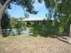 48 Grange St Nannup WA 6275 STOP AND SMELL THE ROSES When you come to Nannup you can hang up the car keys. Buy a bike or simply stroll to shops and café’s and other amenities. Kids can walk or ride to school in relative safety Nannup really is; A place to raise a family. A place to retire A Place to entertain the kids and grandkids. A place where you can feel a part of a community again. 48 Grange Road is one of the larger properties in the street with 2715 sqm. A spacious character home with open plan and plenty of room for entertaining and relaxing. Three bedrooms under the main roof with a self contained flat at the rear with its own facilities. Out Back, for the man of the house, is a 6m x 6m shed with power. The gardens are well established with over 45 roses, numerous natives and 20 varieties of fruit trees that are nearly all mature. A large area of the back yard has been set aside for chook yard and vegetable garden. With a little effort and planning, trips to the local shops for fruit and veges will be a rare occurrence. Come and be a part of this wonderful lifestyle and Community