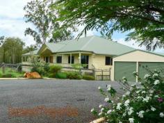 49 Anne Collins Crescent Mundoolun QLD 4285 True Country Living On 7 Acres Final Reduction - Now Only $725,000 A great big sprawling Queensland Colonial with views to Tamborine that really has it all – and is only 3 years old. The 7 acres that the home sits on is divided into 5 paddocks (3 large & 2 small), and has 3 Sheds, a dam, an animal shelter/shed, chook house, and quality fencing (some even dog proof). The home has 4 country sized bedrooms, 2 bathrooms and has verandah’s front and back to take in the truly outstanding views. On entering the home you are met with a massive dual living area with 12’ vaulted ceilings, polished floors, ironbark feature posts, a pot bellied stove especially designed for providing central heating. The vaulted ceilings extend through to the great entertainment area on the back veranda. This home has so much space it will take BIG Furniture. Adjoining the living area is a massive country kitchen with quality all the way. Beautiful rare granite bench tops with timber doors, a Fisher & Paykel induction stovetop,& oven as well as a Kleenmaid dishwasher. You’ll appreciate the 9’ceilings throughout the rest of the home especially in the four bedrooms as it makes for a very cool & spacious living as one should expect. This home although modern and almost new has a wonderful old-fashioned country ‘feel’ about it. This family residence also hosts a fully functional granny flat (or guest wing) with its own living area, kitchen, bedroom and (3rd) bathroom. The home also boasts ‘Crimsafe’ security screens on all the windows and doors. There is a massive storage area under the home big enough for trailers, boat, ride-on mower, and equipment. Much of this space is concreted. This is genuine a working rural property at its finest...Live the Dream! CLICK ON ANY PICTURE TO ENLARGE Situated in ‘The Mundoolun Estate’ that has Over 300 Acres purely dedicated to Wildlife Corridors and Parklands, and is well known for its quality of housing. Each Acreage Property has Town Water, Underground Power & Phone, and Tree lined Kerb & Channelled roads. Just a short drive to the thriving Jimboomba town centre; there you’ll find a fine array of Shops & Café’s including Woolworth’s, Coles, Bakers Delight, Mitre 10, the Post Office, Takeaways and much much more. Only 45 minutes to both Brisbane and the Coast. A copy of the “Sustainability Declaration Statement” for this property can be viewed at our office situated at lot 1 John Collins Drive, Mundoolun. Please call (07) 5546 9093 for our office hours. For an inspection please call (07) 5546 9093 Property Information Area: 7 Acres Bedrooms: 5 Bathrooms: 3 Garage Spaces: 4