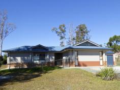 11 King Parrot Parade Gulmarrad NSW 2463 This is a large family home offers room to move and room to grow. A
quality home with many additional features to make life and living a
little easier. It is located in the Gulmarrad area which is only 5
minutes drive from the town of Maclean situated on the banks of the
Clarence River and 15 minutes to the family beach and picnic areas of
Brooms Head.
The entire property consists of a one acre gently sloping block of
land which is fully fenced; a substantial, modern brick home; a
colourbond shed (11m x 6m) with power; a double carport and sealed
driveways.
The home features ducted air conditioning, which controls the
temperature throughout all the living and bedrooms in all seasons. There
are five very spacious living areas - lounge room, dining area, family
room, Media room and outdoor area. The sale of the home includes a
projector and screen in the media room, as well as a built-in stereo and
flat screen T.V. in the entertaining section.
Floor tiles are a main feature throughout and raked ceilings in the
dining room adds to the depth and appeal of the home. The modern kitchen
boasts stainless appliances including a new oven and is located in the
central part of the home. This is the focal point for family activities.
Sliding doors from here lead out to the wonderful screened outdoor area
which offers a fantastic extension of living for entertaining.
The master bedroom features a lovely ensuite with a separate toilet
and a walk in robe with itemised shelving and hanging space. The other
three bedrooms are all very generous in size. They include ceiling fans
and built-in wardrobes. The home also includes a very large study so
there is certainly plenty of room for everyone.
Many of the grand features in this fabulous home are white timber
shutters on all of the windows and sliding doors; ceiling fans, ducted
air-conditioning and LED lights throughout.
This is an exceptional home at a realistic price.