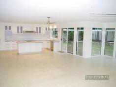 26 Lake Entrance Blvd Noosaville QLD 4566 This as new 4 bedroom, 2 bathroom family home is located just a short distance to schools and shops. Ten
minutes drive will find you at Noosa's famous Hastings St where you can
enjoy a coffee at one of the many trendy local cafes or head over to
the beach for a relaxing swim. The spacious and modern home has
been fully renovated with a massive living/dinning/kitchen area which
opens out onto a sun drenched alfresco patio and beautifully landscaped
gardens, featuring high stone walls and bbq area. A new kitchen with
stone benchtops, new appliances and loads of cupboard space for the
serious chef is waiting to be used for the first time. The bedrooms open
onto a central hallway which separates them from the living area for
extra privacy. The master has it's own ensuite and walk in robe plus
there is another bigger bathroom and separate laundry. - Room for a pool with all the plumbing and electrical work done - Enough space to build a large garage and granny flat subject to approval. - Extensive stone landscaping and mature tropical plants. - Spacious bright and airy space for the whole family. - Room for a shed If you're looking for a modern family home with space and room to extend in a convenient location then you should view this one.