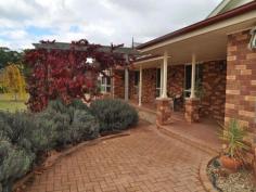 12 Karawatha Drive, Narrandera, NSW 2700 Enjoy the space and privacy this home provides.There is something on offer for the entire family. Your master bedroom features both a walk in robe and built in wardrobe plus a spacious ensuite.The three remaining bedrooms all have built-in wardrobes.Living areas are large and generous, with a separate dining and lounge room in addition to a large family room off the kitchen.A superior bathroom and third toilet ensure ample facilities for you, your family and friends. The kitchen is a standout, and a focal point of this home.It features lovely cathedral ceilings with skylights that adorn the kitchen with beautiful natural light.Comfort is ensured year round with ducted reverse cycle cooling and heating. There are two separate covered outdoor entertaining areas, with the deck at the rear being accessed from the family room and being ideal for BBQ's.The side entertaining area is more private and secluded from the rest of the home and would be an ideal parents retreat. A double garage with power, and double carport ensure plenty of room to park vehicles. A bore is connected to the yard and there is an irrigation system connected to an orchard with established fruit and olive trees.A separate paddock at the rear of the block is perfect for a sheep, and there is a large chook yard in place. Located in a peaceful location, and only minutes to town, this property is sure to offer enjoyment to you and your family for many years to come.