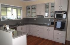 27 West St Millmerran QLD 4357
Renovated 3 b/r home set on 10.94ac – Suit Horse Enthusiast or
Subdivision – Fully renovated 3 bedroom home, 2 b/rs with built-ins
& ceiling fans, new kitchen with electric oven, ceramic cooktop,
display cabinets, pantry & dishwasher, combined with dining and
lounge room, office, polished timber floors throughout living area,
linen cupboard, bathroom with shower & vanity, laundry, evaporative
cooling, new paint inside & outside, bully screened front verandah, 2
car carport, 6000gal tank water connected to house, 8m x 12m shed, 2
car access, 2 open stables, 5 yards, water to stables, fenced into 2
paddocks, water connected to one paddock. This is a unique opportunity
to purchase a large allotment within the town boundaries.