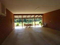 24 Country Rd Gidgegannup WA 6083 GREATLY REDUCED TO SELL - STRICTLY BY APPOINTMENT You will be very impressed with this Rural Building home built in 2001, situated on 11.71 acres of lush pasture with bore & 2 gorgeous dams - 1 spring fed!PERFECT FOR YOUR EXTENDED FAMILY! Both homes are top quality with a neutral decor, high ceilings, good sized floor plans, wide verandahs all round & double carport to separate the two. Ideally located just 15 minutes to Midland CBD via Toodyay Rd, with Gidgegannup Primary school 5 minutes away, this represents top value buying. The orange tree-lined driveway and the immaculate presentation of the entire property will charm you, as will the six lush paddocks & permanent water supply. All fencing & gates are top notch, the 30 x 40ft shed is spacious & powered, and there is nothing to do than move in, sit back & relax. Whether it is Gran & Pop or older kids you need to accomodate, you will be well pressed to replace this at this cost! These brick & iron homes feature the main home with 3 bedrooms, 1 bathroom, lounge/ dining & kitchen open plan, activity room or study with laundry & separate wc, whilst the granny flat has 2 bedrooms, bathroom & laundry together & separate wc. Both have Thermo Duk insulation,they share a solar hot water system, both have electric cooking, with 1 x split system air conditioning unit each.The main home also has a wood fire which doubles as an oven! Owners are keen to negotiate a deal & are wanting to travel! Please call Jan to inspect on 0408 915 281