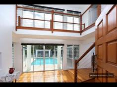 4 GAYNA STREET, KENMORE EXECUTIVE POOLSIDE ENTERTAINER Busy professional families will adore this modern feel and generous size of this special two level residence located in a secluded cul de sac. The convenience, so close to shops, buses, schools and ability to commute north and south of the CBD makes this a perfect family option. Designed with the pool as the central showpiece and loads of glass to capture cross breezes and natural light. With 2 large bedrooms upstairs separated by a breezeway and adjacent to the third bathroom. While the main suite with ensuite and generous walk in robe plus fourth bedroom near the second bathroom is on the ground level. The home office is a superb size and well located. The large lounge and dining can be separated from the other lounge. It also leads out to the poolside patio and looks to the trees on the other side. The beautiful kitchen is exceptionally spacious and has raked ceilings, island bench, rich timber floors and is open to the large family room and casual meals area. There is a private covered deck on one side and more sliding doors leading to the entertaining area with high umbrella. There is loads of storage plus a 3 car lockup garage straight in from the street. Great value and immaculate presentatioD