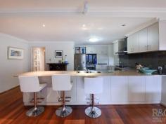 1D Young Street, Melville WA Home Open:  Sat, 16-Aug-2014, 11:30am - 12:00pm The exceptional alfresco area and very chic kitchen/dining/living of this outstanding rear home takes entertaining to a whole new level! Cook and dine alfresco in real style. A built-in BBQ/outdoor kitchen with stainless steel topped benches, splash back and hood; in-built bar fridge, plus timber faced cabinets, perfectly co-ordinated with the cedar lined ceiling above, will impress. Be equally proud entertaining from the chic natural toned kitchen, with hi-spec stainless steel appliances, lattè tinted glass splashback; toning stone top benches, servery and breakfast bar; backed up with a large walk-in pantry for all your gourmet goodies.  Front double entrance doors invite guests into a recessed ceiling enclosed vestibule, with a home office/study (or 4th bedroom) to one side. Opposite, steps lead down to a generous master bedroom; a central passage to the stunning ensuite divides his and her walk-in robes. Similarly, steps lead down to the family wing off of the living area, with two double sized bedrooms, family bathroom, private toilet, laundry with built-in cabinets and an extra large walk-in storeroom.  Polished jarrah floorboards feature throughout indoors. Outdoors, the alfresco, driveway and paths are limestone paved. Included are timber blinds, loads of built in storage, double remote control garage with service entry, alarm system, electric entrance gate, water feature, ducted reverse cycle air conditioning, plus lots, lots more. On a 562sqm Green Title block, in a leafy, sought after street, this home is distinctively impressing. 