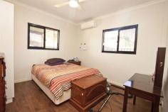 4 Nauclea Way Kununurra WA 6743 Then we have the home for you. This 4 bedroom 2 bathroom eco home is split into two 2 bedroom 1 bathroom homes separated by a large outdoor living area. The main unit has a functional kitchen and dining area, 2 good sized bedrooms and a good sized bathroom. The other unit also has 2 good sized bedrooms, bathroom, a kitchenette and lounge area. All bedrooms and living areas have split system air conditioners and down lighting. The outdoor living area has a basin and kitchenette potential. The yard is of good size and offer a front fence section to keep your pets at bay. Double carport and natural Kimberley inspired garden surround the property and let you relax outside in comfort. With only 4 months remaining on this lease, get in now to secure this property for yourself before lease negotiations begin or purchase as an investment with the properties strong investment potential.