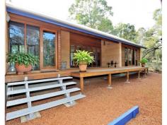 This 3
bedroom 2 bathroom rammed earth, cedar and colorbond home is beautiful,
functional and environmental and takes bold steps in sustainable living.
Built with an enviromental commitment with materials to complement the
Hills setting. The modern design incorporates clean lines,
generous spaces, high ceilings, thicker and tinted glazing, polished
concrete & jarrah flooring and is solar passive. Architect designed in 2003 it has many features such as:- North facing passive solar design Superior internal finishes Solar panels Solid internal doors with Italian door handles SHWS Slow combustion wood fire that heats the water Ceiling fans with Winter & Summer setting Granite bench top in the kitchen with European appliances Taps fitted with ceramic disks for saving water Termimesh Undercover entertaining area with deck Double carport Separate storeroom with built in shelves Separate spacious rammed earth studio with water & power Native gardens Insulation Environmental septic system with no concrete leach drain All this is set on a 1 acre healthy bush block in a cul-de-sac and close to local shops and public transport. To view this amazing home please contact Nathalie on 0414 644 972 Hide Full Description improves the quality of all images on this page.