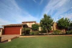 20 Grenfell Way Leeming WA 6149 ONE OF LEEMINGS FINEST!! Magnificent 2 storey home on hilltop location with views to Darling Scarp and nature reserve at the rear. Nothing but the best quality fittings and fixtures - a place you would be proud to call home. Viewing is a must!!! Features include:- Five bedrooms plus large study or 6th bedroom. Two main bedrooms with ensuites, one upstairs and one downstairs. Both ensuites fully renovated and tiled floor to ceiling. Third bathroom also renovated. Separate shower and bath, heated towel rails. Sunken lounge/home theatre with built in timber wall unit/T.V...