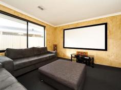 3 Euston Link Bertram WA 6167 You will love this great family home located close to all amenities which is retained above street level for visual impact and privacy. Through the double front doors is a separate entrance hall, to the left is the spacious master bedroom, ensuite with a Roman bath and vanity. To the right is the enclosed Theatre room with bi-fold doors, perfect for entertaining friends. The modern kitchen has lots of cupboard and bench space, island bench, double sink, microwave shelf, double pantry, raised oven, gas cooktop, extra large fridge space and dishwasher. The kitchen overlooks a large dining area and family room with 2 separate sliding doors for access to the patio area.