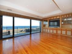 319 W Coast Dr Trigg WA 6029 Look no further – this property is amongst the finest offered in the exclusive suburb of Trigg. With stunning finishes, including American Oak floors, and 180 degree views out to the ocean, this property is unrivalled by most. Extending over three levels, with an elevator to assist, this sophisticated and luxurious home is perfect for family and extended family. Behind the security gates lies 6 bedrooms, 5 bathrooms, 6 wcs, study, cellar, theatre room, 3 to 4 car garage, plus extra security parking within the front courtyard. Ideal for entertaining, there are two full length balconies with glass balustrading. The windows & glass doors are all double glazed for noise resistance. Other features include fully ducted reverse cycle air conditioning, beautiful recessed ceilings and monitored security. Seeing is believing; to truly appreciate the quality and magnificence of this property, contact me to arrange a time to view.