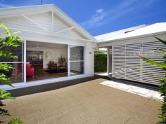 48 Pacific Ave Sunshine Beach QLD 4567 This beautifully presented single level brick home offers a fuss free living, just a few minutes easy stroll to the village and beachfront. What a perfect option for holidaymakers looking for a beach escape so close to the beach. A slatted wall roofed garage sits alongside a security gate in the walled entry courtyard and the home opens up through a wall of glass sliders lining a large living room. This flow through effect is accentuated by a down lit peaked ceiling and the satin sheen of stunning timber flooring. There is access past a trimmed hedgerow at the rear of the garage through to the main entry and vibrant red panels in the boundary fence are softened by grey pavers and ever green Murraya. With the carport acting as a breezeway you can double your entertaining area. A second living area connects through to a well appointed sit up servery kitchen with laminate bench tops, double Smeg wall mounted ovens and electric cook top. There is a window Servery to a fixed roof patio with plenty of room for the outdoor setting. A central hallway feeds to a diagonally set bedroom and a full bathroom. The main ensuited bedroom has sliding door connection to the covered entertaining area. The north east facing rear grounds are a tropical delight. Soaring above an understorey of Golden Cane and Philodendron, a magnificent eight metre high Bismarkia Nobilis Palm shades a gravel pathway to a corner garden shed. The neutral colour scheme, gorgeous timber floors and flow through living rooms, visually expand this single level beachside home. There is room enough for a pool in the side gardens if you like to splash around at home. Pacific Avenue has witnessed a spate of new builds over the last few years and the general consensus of opinion seems to indicate future upgrading and street landscaping. With summer around the corner and the open beaches looking their seasonal best, now is the time to join the beach set.