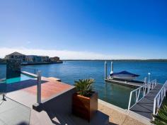 Sovereign Islands, Qld 4216 5 bedroom luxury uniquely elevated to create a floating modern home
• State of the art Smeg kitchen, double oven, butler’s pantry, Caesarstone
• High quality - endless glass, Blackbutt timber, bi-fold doors, open plan
• Luxury master suite features spa, rain shower, deluxe robe, dual vanity
• Theatre purpose built with 3 tiers of seating, Breathtaking ‘glass’ office
• 2009 HIA award winner, triple garage, 23 tonne concrete pontoon berth