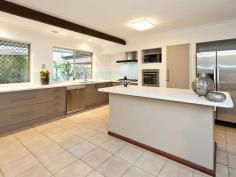 34 Rivermoor Loop, RIVERTON, WA 6148 Located in secluded and exclusive part of the popular suburb of Riverton and in the Rossmoyne Senior High School Zone. Opposite ‘picture postcard’ parklands with backdrop views of the Darling Range Hills. Short walk to the Riverton Leisureplex, the popular Riverton Bridge kiosk and Riverton Forum shopping centre. The home consists of 4 bedrooms with the main being completely separated from the children’s/guest wing which comprises of 3 bedrooms, separate family area, separate toilet and bathroom. Seperate study with views of parklands.