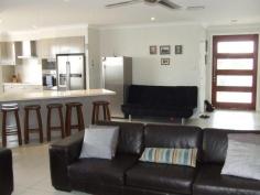 5-7 Blueberry Street Banksia Beach Qld 4507 OLF COURSE ESTATE QUALITY LIVING BELOW BUILD COST This four bedroom golf course estate property is a must to view. The property offers huge side access for caravan, boat or trailer and room for a pool. Add to this ducted air conditioning, media room, all bedrooms are large with built ins and 9 feet ceilings throughout. Outdoors entertain on your large timber entertainment deck.