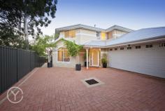 84B Basingall Street East Victoria Park WA 6101 ucked away at the end of a long, plant-lined driveway, this contemporary two-storey home has a grand, limestone brick facade and is surrounded by low-maintenance planting, giving it a clean, Mediterranean appeal. Built in 2001, it has been beautifully maintained by its current owner - there is nothing to do except move in. The house is freshly painted in neutral creams throughout, with quality drapes, elegant light fittings and split-system air-conditioning in all the bedrooms, and brand-new wool carpets on the first floor. It's flooded with natural light throughout the day, and benefits from beautiful views of the surrounding landscape from the first-floor balcony. The front door opens into a grand entrance, with steps through an archway leading down into a spacious open-plan living room with gas fire, cream tiled floors and high ceilings. The dining area looks out over the back garden, and the generous kitchen has a moveable island bench, walk-in pantry and ample storage. The reticulated, easy-care back garden has a large limestone-paved terrace and is filled with rose bushes and citrus trees, as well as a beautiful water feature. It's a lovely, quiet spot for a barbecue or glass of wine in the evening, and benefits from the tranquillity of neighbouring gardens. The ground floor also has a large guest bedroom with a walk-in robe, views out to a water feature, and an adjacent white-tiled bathroom. Upstairs, a smaller living room with a sink and space for a bar fridge is perfect for curling up on winter nights. A huge balcony is one of the owner's favourite spots for breakfast, offering panoramic views towards the hills and over the surrounding trees and gardens through wooden venetian blinds. A beautiful main suite benefits from the elevated views, and features a large ensuite with a dressing room/walk-in robe. Two more bedrooms, one with another walk-in robe, complete the first floor. As well as being beautiful, the house is very practical, with a ducted vacuum system, a double garage/laundry with its own entrance the house, and an attic space for storage over the garage. The home is well positioned yet private and set back from the road: just four kilometres from the CBD and close to schools, Curtin University, the causeway and the Graham Farmer Freeway. There's also a local shopping centre and library down the road, as well as the restaurants of Victoria Park on your doorstep.