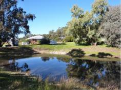 24 Country Rd Gidgegannup WA 6083 GREATLY REDUCED TO SELL - STRICTLY BY APPOINTMENT You will be very impressed with this Rural Building home built in 2001, situated on 11.71 acres of lush pasture with bore & 2 gorgeous dams - 1 spring fed!PERFECT FOR YOUR EXTENDED FAMILY! Both homes are top quality with a neutral decor, high ceilings, good sized floor plans, wide verandahs all round & double carport to separate the two. Ideally located just 15 minutes to Midland CBD via Toodyay Rd, with Gidgegannup Primary school 5 minutes away, this represents top value buying. The orange tree-lined driveway and the immaculate presentation of the entire property will charm you, as will the six lush paddocks & permanent water supply. All fencing & gates are top notch, the 30 x 40ft shed is spacious & powered, and there is nothing to do than move in, sit back & relax. Whether it is Gran & Pop or older kids you need to accomodate, you will be well pressed to replace this at this cost! These brick & iron homes feature the main home with 3 bedrooms, 1 bathroom, lounge/ dining & kitchen open plan, activity room or study with laundry & separate wc, whilst the granny flat has 2 bedrooms, bathroom & laundry together & separate wc. Both have Thermo Duk insulation,they share a solar hot water system, both have electric cooking, with 1 x split system air conditioning unit each.The main home also has a wood fire which doubles as an oven! Owners are keen to negotiate a deal & are wanting to travel! Please call Jan to inspect on 0408 915 281