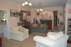 2 Lynches Road - Sue Ross Real Estate GuyraA delightful south-side character home that seamlessly combines modern living and traditional features. Set on a fully fenced 3.31 acre corner block, the home is located in the highly sort after South Hill area. The home is surrounded by established cottage gardens that provide a number of nooks to relax in. The
covered front landing leads into the lounge which has a lovely wood
heater that keeps the home toasty warm on cold days and nights. This
flows through to a combined dining and kitchen area. The kitchen is
beautifully appointed with Caesarstone benchtops, extra wide stove with
ceramic cooktop, dishwasher, ice maker refrigerator and oodles of
storage. The master bedroom includes a beautifully appointed ensuite with spa bath, built-in wardrobe and garden views. Features include: 4 bedrooms 3 bathrooms 2 living areas Study/Office As new galley kitchen Sewing nook Several outdoor entertainment areas Rear timber deck Wood heating RVC air-conditioning Single garage Large workshop Several garden sheds Chicken run Tranquil surrounds Large 3.31 acre fully fenced block Council approved subdivision potential The
new owner will also appreciate the quiet, friendly nature of the
neighbourhood, the welcome privacy, the lack of noise pollution often
associated with higher density living areas and the easy access to the
CBD. Vendors are on the move so don’t delay with your interest!
