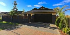 259 Kingsway Darch WA 6065 Looking for a stylish and spacious family home in a convenient location? Look no further as this is sure to please. Among the numerous attributes included are the following:- • 4 Good sized bedrooms, all with large robes • 2 Luxury bathrooms. The ensuite has corner spa bath & double vanities • Modern kitchen with plenty of bench and storage space • Large walk-in pantry • Quality stainless steel kitchen appliances including dishwasher • Coffered ceiling in family room • Expansive open plan living, meals and kitchen areas • Flued gas fire • Separate games/theatre room with bar • Ergonomic laundry • Under main roof alfresco + covered patio at side of house • Oversize double garage with access to rear garden • Wet kitchen in separate building • Shower room/3rd toilet at rear of house • Reverse cycle air conditioning • Timber floors • Space for swimming pool • Large easy maintenance gardens • Roller shutters to front of house • Fully fenced front garden • Modern elevation • Convenient location on bus route • Close to schools & shops Perfect for the growing family so make sure you view this weekend so you are not disappointed.