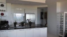 47,1-7 Breakwater Access Road, Mackay Harbour 4740 A wonderful coastal scene is laid out before you from this elegant and crisp apartment. A thriving harbour and surf beach offer activity and interest. This interestingly laid out apartment is beautifully presented and customised with flair and intelligence.
