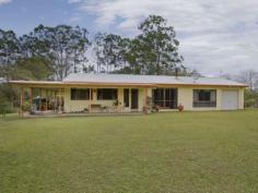 56 London Creek Rd Peachester QLD 4519 Northfacing, private Bessa Block home, nestled on 8 acres of land
with 360 degree views, including Mt Beerwah, Mt Mellum, and Mary
Cairncross Park. Perfect for Horses!
HOUSE FEATURES:
* The house is full of character with fully insulated raked ceilings and
a solid stone feature wall between lounge room and main bedroom.
Wrap around verandah from Front Door around end of house (BBQ area)
* 4 bedrooms — main bedroom has a large changing room attached
* 3 car spaces in shed and the 1 attached to the house. 2 open car spaces and 2 secure car spaces.
* Single garage attached to western end of house -could easily be
converted to a self-contained granny flat with TV outlet, lights and
electricity already installed.
* Lounge room, large kitchen and dining room with large walk in pantry and full gas cooking stove top and wall oven.
* Ample bench and cupboard space.
* Large bathroom with built in storage cupboard, separate large shower, vanity and bath.
* Home is tiled throughout for easy cleaning.
* Wood fire/heater with plentiful supply of firewood from land.
* Bosch Hot water system with instantaneous turbo ignition gas.
* Automatic tank switch when one gas tank runs out.
* Outside lighting at front, end and back of house. There are 2 Flouro lights in BBQ area.
SHED AND LAND:
* 40 x 20 Four bay shed with power.
* The property, horse stables and it is fully fenced into four separate paddocks, with water troughs in each.
* Unlimited drinkable water supply from Bore and pump.
* Bore water is pumped automatically to a holding tank and then is
filtered before use throughout the house. Also has rain water tank.
Vegie patch, chook run, and various fruit trees.
* Peace and quiet, plenty of bird life.