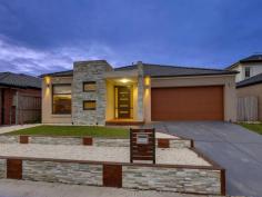 22 Evadene Dr Tarneit VIC 3029 CLASSY CONTEMPORARY DESIGN WITH LOADS OF SPACE!
Sleek design, classy décor and plenty of
space for the growing family is what this beautiful property presents.
Master bedroom with a stunning en suite and walk in robe, three other
spacious fitted bedrooms, large teenager’s retreat/study, massive open
plan family meals area leading through to a massive rumpus/theatre room
and sliding doors out to a lovely timber decked BBQ outdoor entertaining
area.
Pristine quality floating timber floors, halogen lighting, high
ceilings, a gorgeous hostess kitchen with shimmering stone bench tops,
glass splashbacks, Technika 900mm stainless upright cooker, Technika
dishwasher, ducted heating, alarm system, double remote garage, solar
system for electricity savings, side access gates and low maintenance
manicured gardens. The perfect family home positioned within walking
distance to schools, public transport and Tarneit west shopping village
and Tarneit central just a few minutes’ drive down the road.