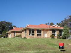 Bermagui NSW 2546 A high quality 3 bedroom ensuite home with great street appeal, plus additional boat/caravan garaging. A sunny and spacious open plan design features a split level living space at one end, that adds interest and variety to the design. At the other end sits the kitchen with stainless steel oven and ceramic cooktop, and access to a paved rear patio. The living space and front verandah enjoys northerly views over the surrounding area with ocean glimpses in the distance. As well as a double garage with internal access to the house, there is a detached metal garage with extra high clearance especially for boats or caravans.