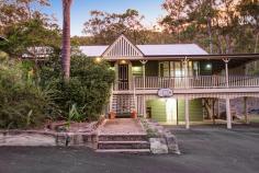 9 Warrandyte Court Camp Mountain QLD 4520 Position is a key feature that differentiates this property from others in the Samford district and indeed acreage properties in Brisbane generally. Only 7 mins to Ferny Grove train station means transit to the city centre and events is easy and quick. Driving time is only 30 minutes to the city. Uniquely situated at the base of Camp Mountain, bordering the D'Aguilar National Park, with nature trails right at your doorstep, lies this hidden gem on 3.75 acres. Privacy is paramount and the new owners will enjoy a chilled and relaxed lifestyle with the assets that abound. A recent extension by Garth Chapman Queenslanders has created a large 6.8 x 6.5m outdoor pavilion. Such a beautiful space, it has everything you need for entertaining in style built in seating, BBQ with stone bench tops, storage areas and tv points, ready for your widescreen TV. Take 2 steps down from the pavilion and you are in your massive, granite paved sparkling pool area with semi frameless glass fencing, hot water outdoor shower, beautiful water feature and a pump room that is impressive in itself, allowing convenient storage for chemicals, pool toys etc. This will be a place you will be very proud to entertain from. Adjacent to the pavilion area is the kitchen has had a recent update whilst retaining its farmhouse kitchen styling, with stone bench tops, step in pantry and quality 900mm Smeg freestanding oven and gas cooktop. Large windows open out to a servery, and are conveniently positioned to make entertaining a pleasure. This majestic north facing Queenslander has 15 foot vented timber ceilings and careful window and silky oak French doors to the wide verandahs. This home is very cool during the summer months and with the use of the ceiling fans has no need of air conditioning. The family room features a brick open fireplace, ensuring many winter months enjoyed by the warmth of the fireside. The bedroom wing has of 4 bedrooms, 3 of which have new built in wardrobes with custom shelving. These all open out to a rumpus area with floor to ceiling sliding doors which open up to allow further breezes to flow through. The master bedroom is spacious and features a large walk in robe and ensuite with sunken spa bath and sash windows that can be opened up to enjoy the views while soaking the day away. Downstairs, a recently built 6m x 6m office is perfect for those who work from home with its separate entrance, but could be used as a teenage retreat or media room perhaps? The owner has taken advantage of the lands natural drainage, which allows water to flow to the dam with pumps for irrigation to the gardens and a total of 80,000 litres of water storage ensures you should never run dry.