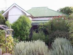 35 BUDD ST, Berrigan AREA:758.8 sqm
LOCATION: Situated in Berrigan's most convenient street, close to shops,
Sporties Club and all facilities. With a corner block and rear lane
access giving 3 entry points to this small easy care block.
'WELCOME HOME", to this well presented Classic Aussie charmer with
fabulous pressed metal on ceilings and walls and Murray pine
floorboards, lovely gardens and front bull nosed verandah.
* The kitchen has an operating fuel and electric stove, plenty of cupboards and bench space for an older style home.
* This leads to a dining/living area with open fireplace, and ceiling fan.
The lounge room (or parlour as it was known as way-back-when) has a window-style air conditioner, oil heater and bay window.
* Although no built-in wardrobes in the two generous bedrooms, there is
ample room for them and existing furniture in the home can be
negotiated.ppl
* There is a large sleep-out running two thirds the length of the home which could be another bedroom or office/bedroom.
* The spacious bathroom/laundry has corner bath/shower, vanity with ample cupboards and shelving.
* Separate toilet.
THE FULLY FENCED YARD HAS GOOD SIZED OPEN SHEDS AND DOUBLE CARPORT - LOVELY ESTABLISHED TREES AND VERY PRIVATE.
AFFORDABLE AT $99,000
