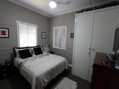26 Victoria Street, Clifton QLD 4361 Tastefully renovated to designer standards with two good sized bedrooms, the main with an added benefit of a wood heater, built-ins in both bedrooms. The large carpeted lounge/dining room also has a wood heater, ceiling fans and gas point, the tiled bathroom has a large shower and is located between the two bedrooms. The modern kitchen has ample cupboards including a pantry, gas stove, dishwasher and for convenience, the laundry is in the kitchen. An added bonus is the extra room off the kitchen at the back of the house which overlooks the spa, the manicured lawns, gardens & bar-b-que. This room would be suitable for a number of uses such as a sun-room, reading room, or extra bedroom and with external access it could also be used for a home business, currently it is being used as an extra living area. The outside is just as outstanding as the inside with a bar-b-que area, a covered spa fully fenced, three garden sheds, manicured gardens and lawns with mature hedges, water tank, back yard access with a second carport or entertainment area on a fully fenced easy care 708m2 block . Everything in this home has been well thought out and executed to a high standard, this cottage would suit a business couple or those already in or close to retirement as there is an easy walk to bowls club and town.