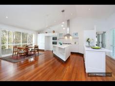 4 GAYNA STREET, KENMORE EXECUTIVE POOLSIDE ENTERTAINER Busy professional families will adore this modern feel and generous size of this special two level residence located in a secluded cul de sac. The convenience, so close to shops, buses, schools and ability to commute north and south of the CBD makes this a perfect family option. Designed with the pool as the central showpiece and loads of glass to capture cross breezes and natural light. With 2 large bedrooms upstairs separated by a breezeway and adjacent to the third bathroom. While the main suite with ensuite and generous walk in robe plus fourth bedroom near the second bathroom is on the ground level. The home office is a superb size and well located. The large lounge and dining can be separated from the other lounge. It also leads out to the poolside patio and looks to the trees on the other side. The beautiful kitchen is exceptionally spacious and has raked ceilings, island bench, rich timber floors and is open to the large family room and casual meals area. There is a private covered deck on one side and more sliding doors leading to the entertaining area with high umbrella. There is loads of storage plus a 3 car lockup garage straight in from the street. Great value and immaculate presentatioD