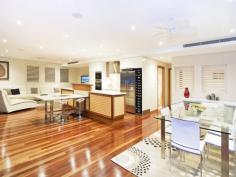 5/61 Garrick Street Coolangatta Qld 4225 This sublime four-bedroom apartment is 1 of only 6 in Coolangatta’s most exclusive residence, and features a high-specification contemporary interior, expansive indoor and outdoor entertaining space and breathtaking panoramic views. Boasting exceptional luxury in every room, this outstanding and stunning home has the ambience of a magnificent retreat perched high on its own hilltop oasis, yet is ideally placed only moments from the restaurants and cafes lining the best beaches on the Gold Coast. From your car park, the lift glides up to your own floor where a grand entrance will meet you as you step inside your own superior showpiece: • Largest whole-floor apartment within this boutique building • Walk to beach • Ocean panorama from Rainbow Bay to Cook Island • Quiet, residential location • Timber bi-folds span whole width of terrace for seamless flow of indoor/outdoor living • Expansive timber flooring, lush carpeting and plantation shutters • Sleek, stylish, sophisticated kitchen with Miele appliances • Teppanyaki bar off kitchen counter • 5 wall-mounted LCD TVs • In-built $35,000 stereo system pipes music around the home • Secluded main bedroom with amazing ensuite and sumptuous spa bath • Floor-to-ceiling tiles in both spectacular main bathrooms • The ultimate guest suite • Audio-visual intercom security • Daikin ducted air conditioning • Three bathrooms including powder room • Very low body corp • Residents’ saltwater pool with thatched Balinese pavilion with BBQ & fridge • Two secure car parking bays • Located on leafy, peaceful street • Master Builders Queensland 2008 Winner Best Residential Building up to $12 Million …and there’s a whole world more of gorgeous features waiting to be discovered…