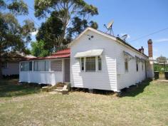 55 Barawell Street Stanthorpe Qld 4380 Set in the village of Wallangarra about 25 minutes from Stanthorpe and set on a generous allotment of 1,012m2. This home has plenty of space to offer, 4 large bedrooms, separate lounge room, eat in kitchen plus 2 bathrooms. Home is kept warm with a wood heater and with the addition of the old style combustion stove in the kitchen the winter months are not a problem. Very solid chamferboard home with enclosed front verandah a perfect North facing sunroom. Outside offers a 3 bay shed with built in inspection pit for the mechanically minded and a generous backyard. Located only a short walk from the general store and post office. Solid, spacious family home and competitively priced.