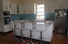 384 Millmerran-Inglewood Rd Millmerran QLD 4357
Large fully refurbished 4 bedroom home.
UPSTAIRS- 2 bedrooms 1 with built-ins, both with rev cycle A/C. Formal
lounge with rev cycle A/C and fireplace. New kitchen w/- walk-in
pantry, elect wall oven, ceramic cooktop, dishwasher and adjoining
dining room. Main bathroom with vanity & shower over bath. Linen
cupboard with laundry chute. Sep toilet. Sep office.Front verandah.
DOWNSTAIRS– 2Bedrooms with built-ins. Laundry, toilet, vanity and
double shower combined. Linen cupboard. Large rumpus room with bar.
Outdoor entertaining area attached. All this on approx 21Ac. Fenced
into 3 paddocks. 1 dam, bore pumping approx 1000Gal/Hr & 2 troughs.
25000Gal rainwater & town water connected. Outdoor storage area
& cubby house. Chook run, dog run & fenced house yard. Single
remote access garage. Large 8m x 13m shed on slab with power. 3 roller
doors, 6m x 6m skillion attached. Established low maintenance gardens.
This is a rare opportunity to purchase lifestyle acreage within the town limits. A must inspect property.