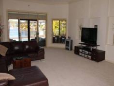 26/40 Cotlew St Southport QLD 4215 The Best Of Lifestyle Choices 4 beds + study/ office, 3 bathrooms, 2 car garage. Once
you enter the security gates of the estate, you will find yourself in a
world removed from the typical hustle and bustle, and the daily grind
on the Gold Coast. Just imagine entering the front door of your prestige
property too relax, overlooking your pool and the expansive waterway at
your rear boundary. This home is filled with quality fixtures and
fittings, a hostess kitchen, and bathrooms to luxuriate yourself in. The
bedrooms are more than ample with built in robes to each. Can't you
just see yourself lazing by the pool or having friends and family over
for entertaining? Life would be great with a fully serviced tennis court
at your finger tips, a sensational way to burn off energy or have fun
with those who are important to you. When it comes to convenience the
best of schools and the shops are only a short distance from your home.
The Gold Coasts Premier night life precinct is close enough to enjoy but
far enough away to not be imposing upon your quiet lifestyle. The
popular Southport Golf Club is accessible from the estate and your only a
short stroll too the Marble bar. Just imagine all this at your finger
tips with the knowledge that you are safe within your fully secured
estate lifestyle. What more could you want for your family and yourself. This property deserves your consideration and you deserve this delightful home. Inspection by appointment is the best way to see all that this home could offer you. Call Ross Busby 0450 271 287