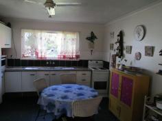 Tivoli, QLD, 4305 - Walkers Real Estate Good central location within a few minutes by vehicle to highway,
Riverlink shopping complex. Handy to Primary schools. Bus transport
available at door. Dwelling features 2 bedrooms, master with built-ins,
formal lounge, spacious kitchen with dining attached, large carport,
outdoor BBQ/recreation area. No flood. Space for a shed or pool. 818m2
allotment