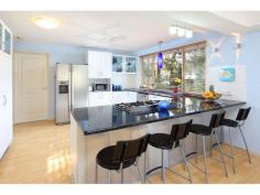 41 Phillips Street COOCHIEMUDLO ISLAND QLD 4184 Family Reunion Magic Huge Coochie Beachhouse Opportunity At the end of the day many of us ow realise this life is about relationships and family. Well here is the opportunity for 3 or so families to share their own holiday home and also rent it when the family are not sing it. We all dream of living on a beautiful tropical island. That dream comes true in this home just 160 metres from sandy Norfolk Beach. Welcoming your family and friends onto your spacious front deck. We all crave the simple pleasures of life, well this bright airy, huge five bedroom, four deck, three level home provides living in true beach house style, with water views and every room opening to decks capturing magic bay breezes.