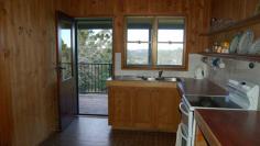 Witta, QLD, 4552 This one acre property (3917 sqm) is ideally situated, enjoying good elevation and a lovely outlook across Witta, as well as a high degree of privacy. The two bedroom timber house has loads of character with timber VJ internal walls and ceilings and polished hardwood floors. With 2 bedrooms and a single bathroom the home is suitable for a small family, couple or a weekender for the lifestyle buyer. With a full length verandah on two sides of the home, comprising new decking and balustrade, the outdoor living area takes in the view and offers a lovely aspect over the land. The kitchen and bathroom are original to the home and have been left that way for the new owner to change according to taste. With features such as high ceilings, exposed timbers, fireplace, verandah and a rolling hills outlook buyers will not be disappointed. The property is accessed by an all weather driveway which leads down to the garage, offering additional space for storage and workshop. Rainwater storage is 8000 gallons split between two galvanized tanks.